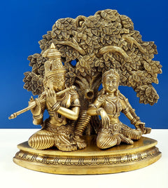 Handmade brass Krishna flute statue with Radha seated, ornate tree canopy detail