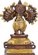 Rear view of brass and dark bronze Ganesha sculpture with sixteen arms, round disc back