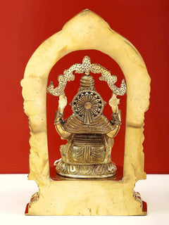 Brass Ganesha idol on pedestal with tall prabhavali backdrop, 9-inch