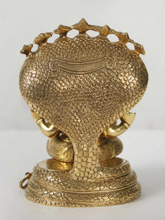 Brass Sheshnag base and back of seated Ganesha statue with textured scales