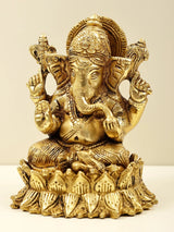 Brass Lord Ganesha figurine seated on lotus, side view showing trunk and crown
