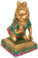 8-inch Brass Gopala idol seated, holding laddoo, green robe with red accents