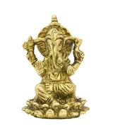 Brass Ganesha statue, seated with trunk and ornamental detailing, 2 inch