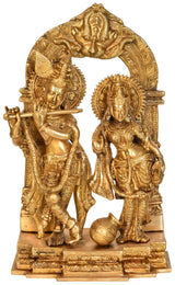 Natural brass Radha Krishna sculpture with milk pot, 14-inch