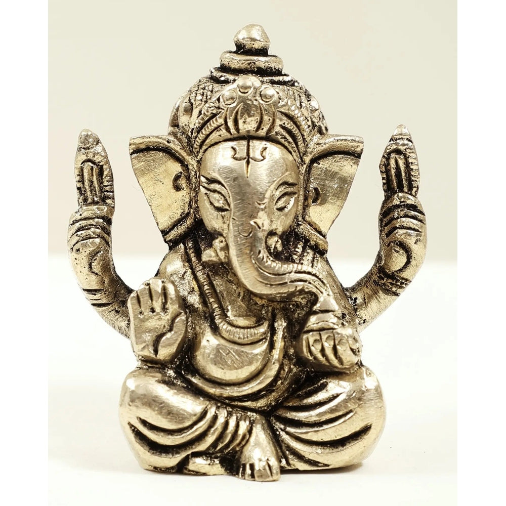 Brass Ganesha mini statue, seated with raised arms, ~2 in