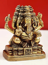 Brass Panchamukhi Ganesha statue, detailed headdress and four arms, front on base