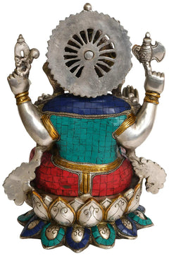 Brass Ganesha statue back view with large halo disc, teal and red tiled outfit