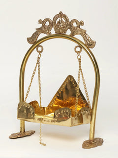 Brass deity swing frame with peacock top, hanging chains and arched panel