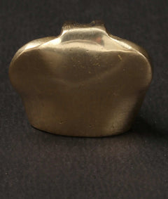 1-inch brass Ganesha statue, back view with smooth rounded body and crown