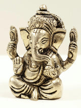 Brass Ganesha mini statue with ornate face and crown, ~2 in
