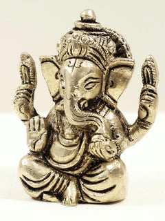 Brass Ganesha mini statue with ornate face and crown, ~2 in