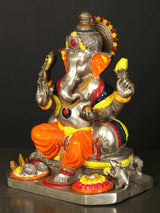 Brass Lord Ganesha statue with orange dhoti and raised hands, seated on base