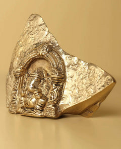 Natural brass Ganesha temple idol, detailed trunk and headdress in arched frame