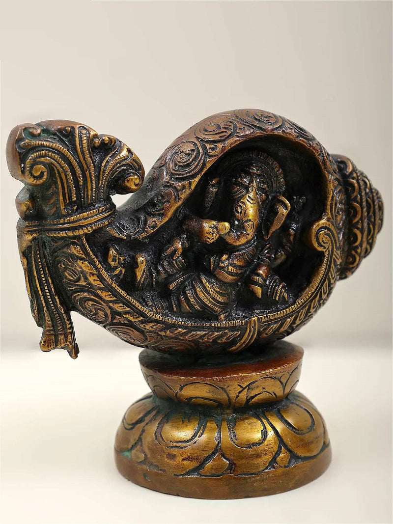 Small brass statue of Ganesha depicted with a conch (Shankha)