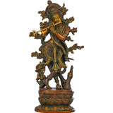 Handmade brass Krishna idol playing flute, ornate crown and many decorative arms, 12 in