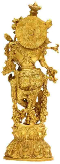 Gold brass Murlidhar Krishna statue with ornate crown and spiral back details