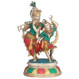 Brass Radha and Krishna dance sculpture, green and red jeweled outfits, raised arms
