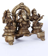 Brass Ganesha, Lakshmi and Sarasvati triad with arched backrest, 5-inch
