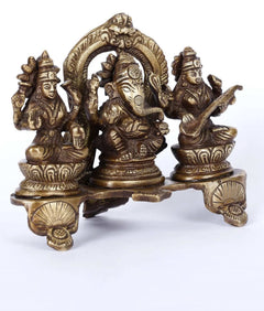 Brass Ganesha, Lakshmi and Sarasvati triad with arched backrest, 5-inch