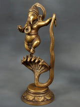 Brass dancing Lord Ganesha figure, one hand raised, on coiled Sheshnaag with fan base