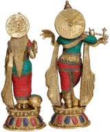 Krishna–Radha brass statue, rear view with colorful inlay and ornate headpieces (AONA)