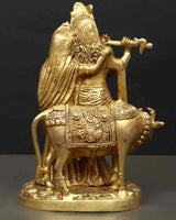 Radha Krishna brass statue from back, cow mount visible, ornate sculpted patterns