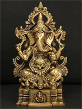 Brass seated Lord Ganesha statue with ornate crown and four arms, 12 in