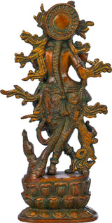Krishna brass idol playing flute from behind, circular halo design and ornate pedestal