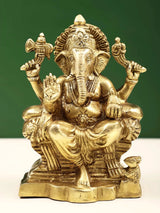 Brass Raja Ganpati statue, seated deity with raised hands and detailed crown, 5 in