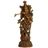 Brass Murlidhar Krishna statue with ornate detailing and flute, standing on pedestal