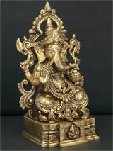 Brass sitting Ganesha figurine with raised hand gestures and carved base details