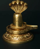 Brass Shiva linga with decorated Sheshnag serpent hood, 4-inch tabletop decor
