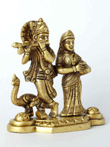 Aged-brass Radha and Krishna figurine on round base, detailed jewelry and crowns
