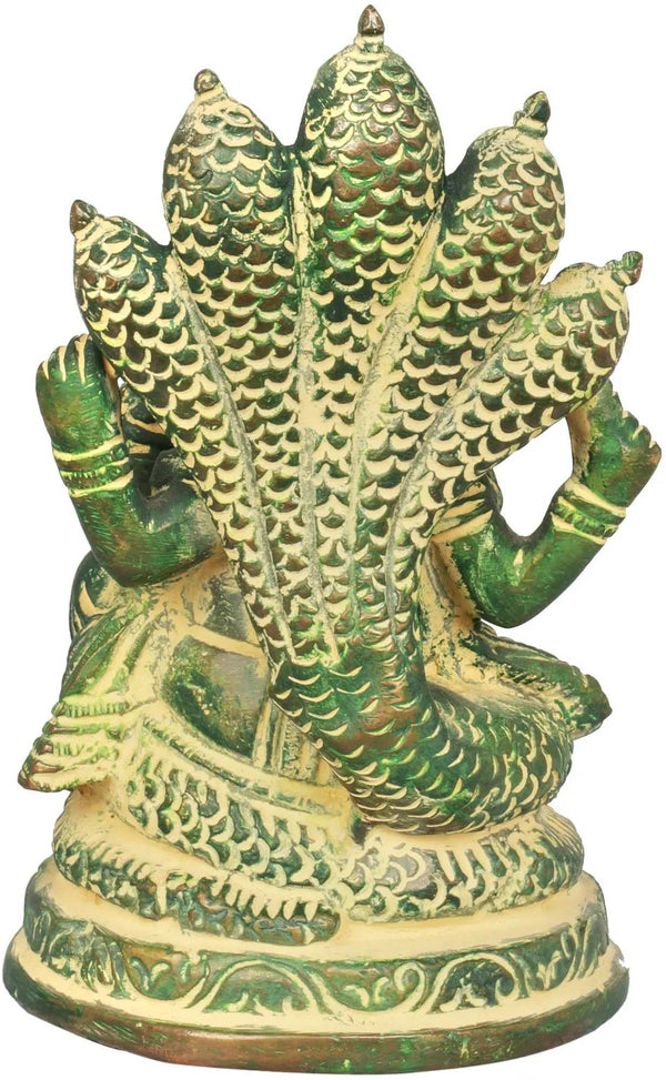 Small brass mudgreen sculpture of Ganesha seated on the Shesha Naga 5 inches Study Setting