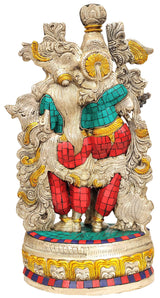 Radha-Krishna brass statue back view, ornate filigree with teal and red mosaic attire