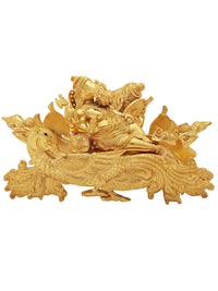 Gold-plated Ganesha idol reclining on a peacock recliner, detailed brass sculpture