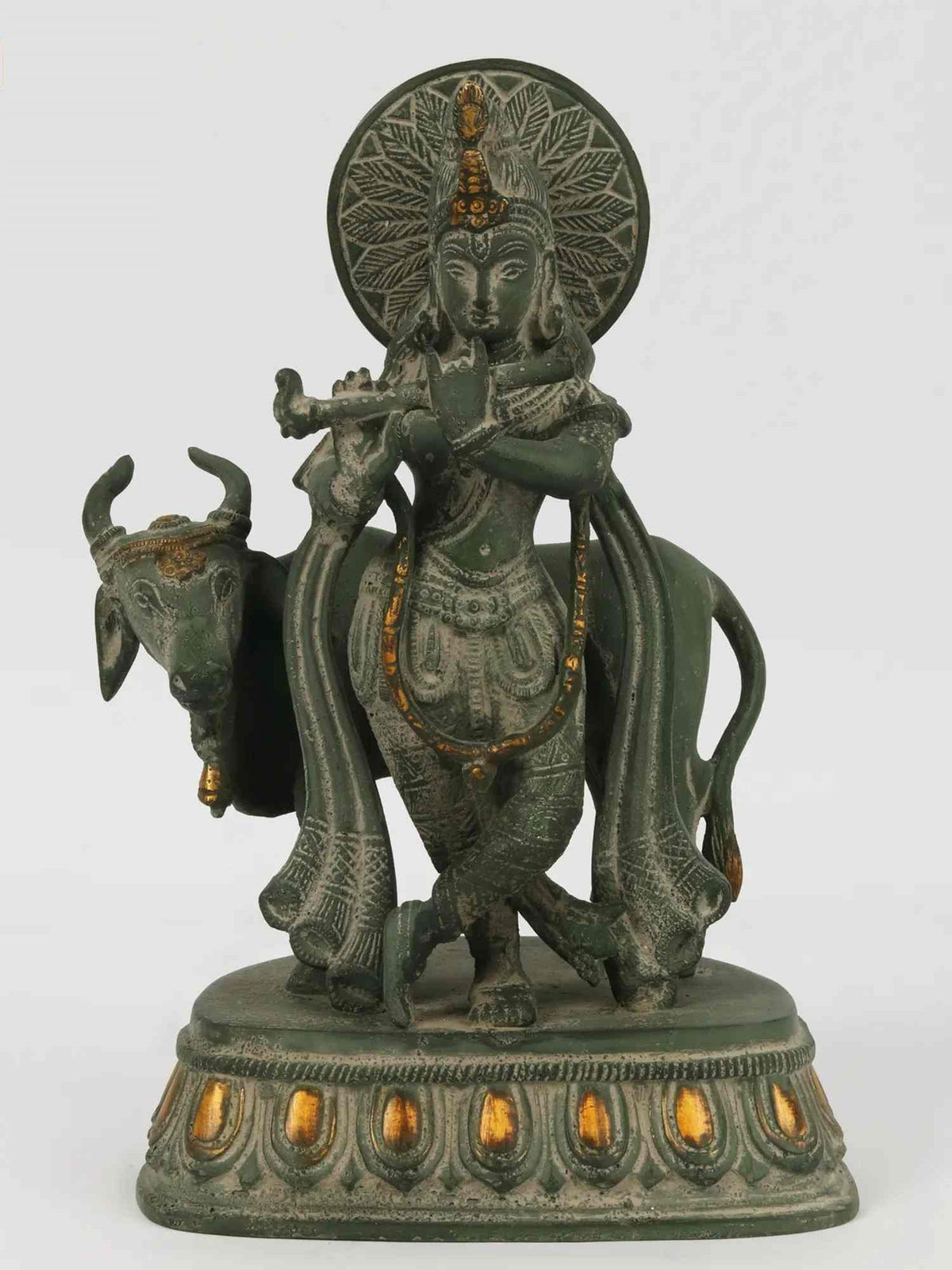 Green patina brass Krishna statue with cow, detailed base and halo, 10 in