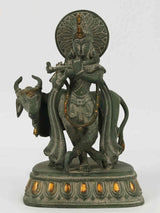 Green patina brass Krishna statue with cow, detailed base and halo, 10 in