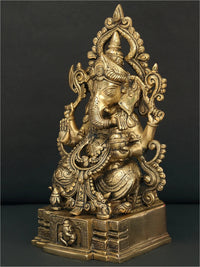 Brass Lord Ganesha sculpture, seated side view with detailed jewelry and ornaments
