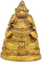 Brass three-headed Ganesha statue from back, detailed drapery and base