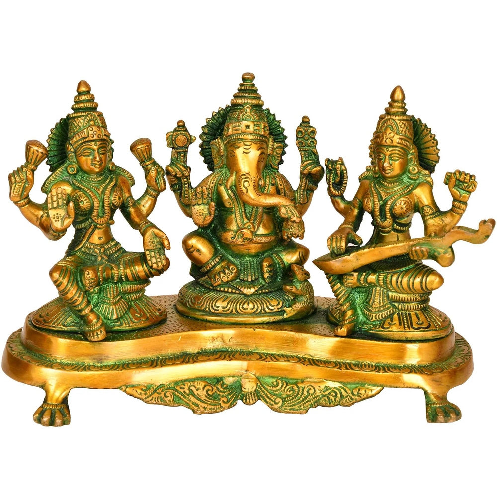 Brass Lakshmi-Ganesha-Saraswati figurines on ornate pedestal base