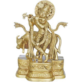 Gold brass Krishna playing flute statue with cow, 9 inch base