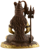 Back view Shiva statue, dark brown seated on gold base with trident