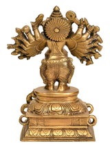 Natural brass Vira Ganesha with raised central disc, 16 arms, engraved pedestal, 8 in