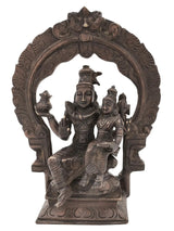 Antique brass Shiva Parvati statue with multi-armed deity figures on circular arch