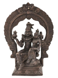 Antique brass Shiva Parvati statue with multi-armed deity figures on circular arch