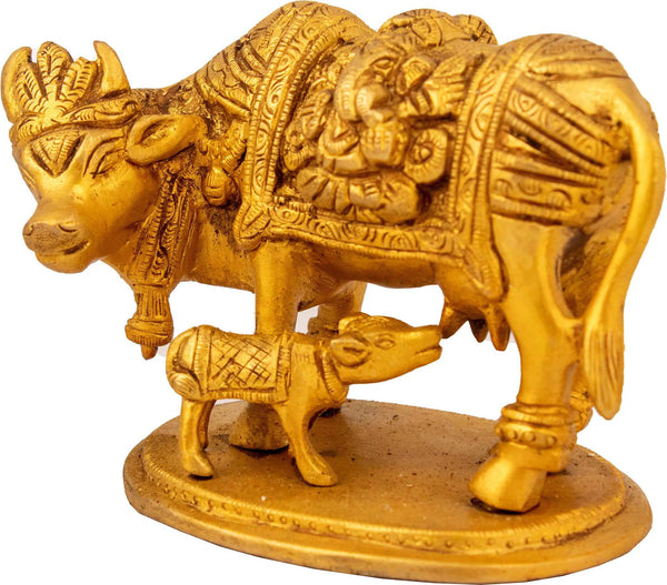 Mother cow nursing her calf with Lakshmi and Ganesha carved on either side of her robe 3 inches