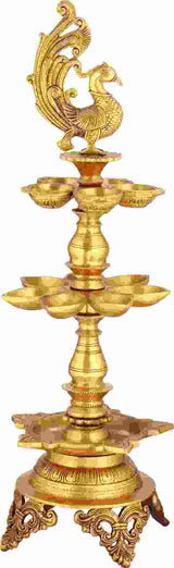 Handmade gold brass puja lamp with deity figure and three-layer wicks, 24 in