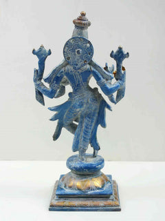 Back view of blue Lord Krishna brass statue with decorative headpiece, on square base