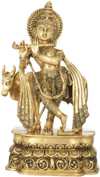 Handmade brass sculpture: Krishna plays flute beside cow, ornate detailing, 19 in